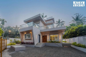 StayVista at Serenity Shores with Pool, Bonfire, Lawn
